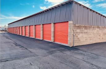 https://unsplash.com/photos/a-storage-building-with-red-doors-and-a-sky-background-OpV94f2edwE