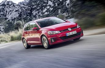 Volkswagen Golf GTI driving along road