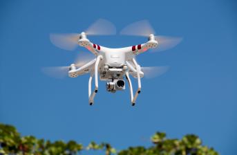 Flying Drone, possibly used in future traffic management drone flying to show possible usage in future traffic management