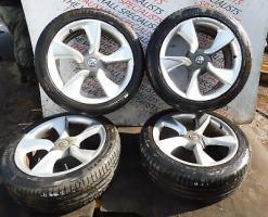 VAUXHALL ASTRA GTC 09-16 SET OF ALLOY WHEELS + TYRES 235-45-19 13312751 *SCUFFS